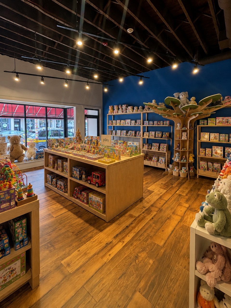 Shelves of fun, educational toys inside the Six Little Ducks toy store