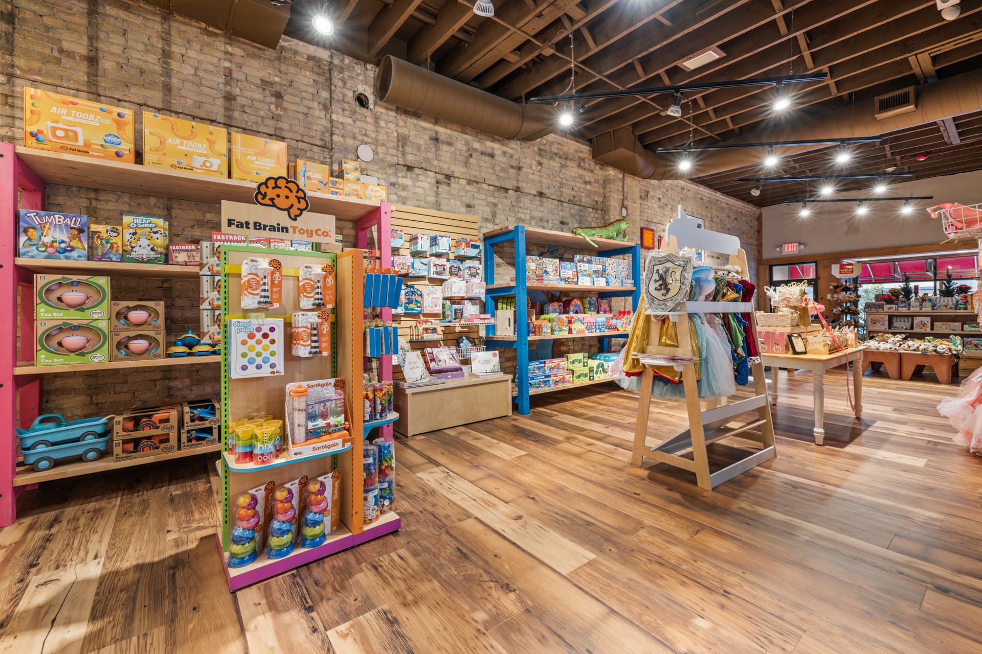 Games, building toys and dress-up clothes on colorful shop displays