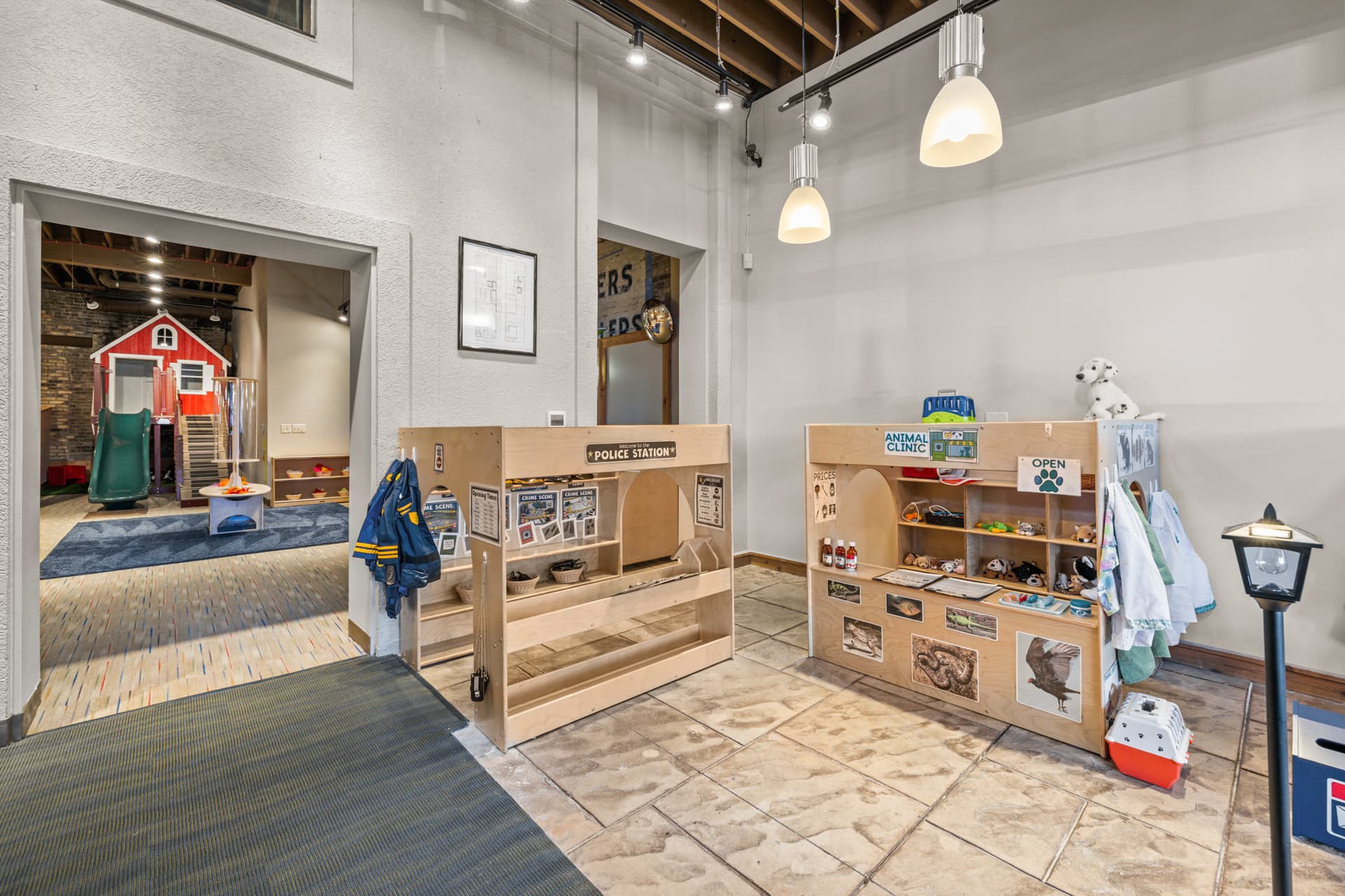 Small town play village with a police station and animal clinic at Six Little Ducks indoor play space
