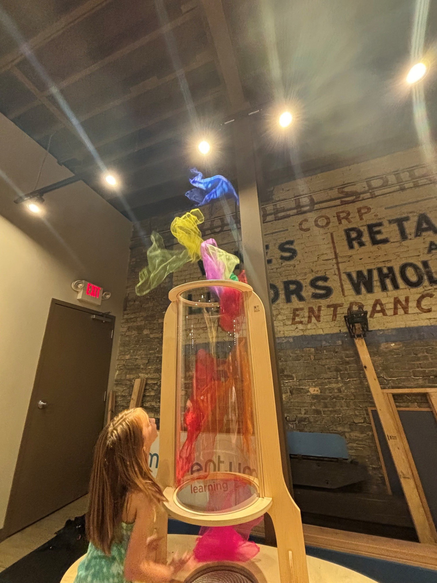 A child watching the vortex tube at the Six Little Ducks play space