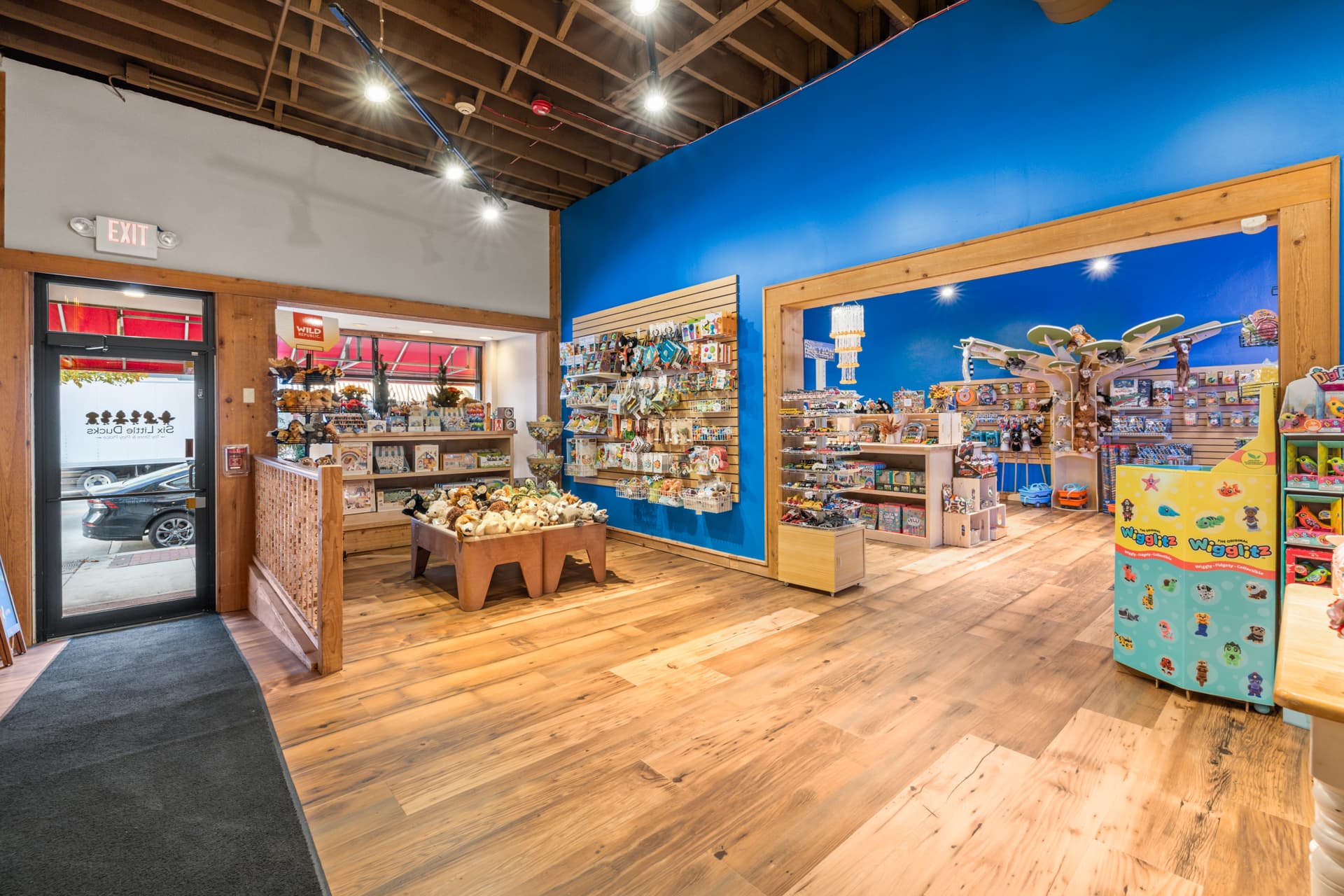 Wide view through both rooms of the Six Little Ducks toy store